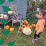 little girl at halloween events in nottinghamshire with pumpkins