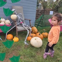 little girl at halloween events in nottinghamshire with pumpkins