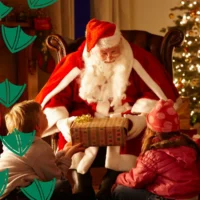 where to see santa in nottingham picture of him in his grotto with children giving out presents