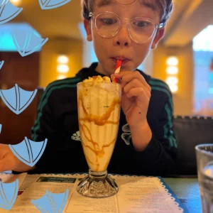 Boy frinking a milkshake in derbyshire resturant sorbo chesterfield