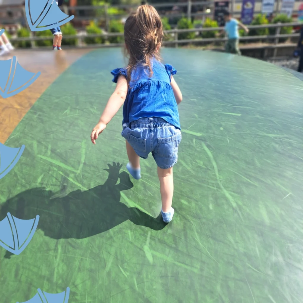 little girl on balloon pad in matlock park farm derbyshire