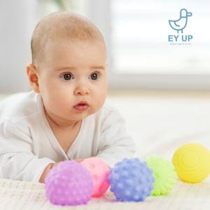 baby on tummy time in baby class in derby