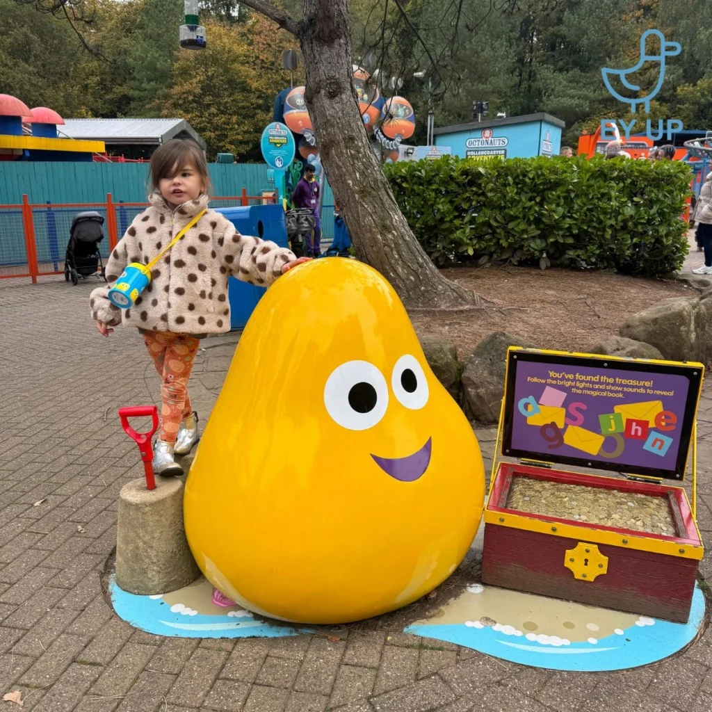 little girl standing in cbeebies world alton towers
