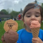 little girl eating ice cream at may half term in derbyshire